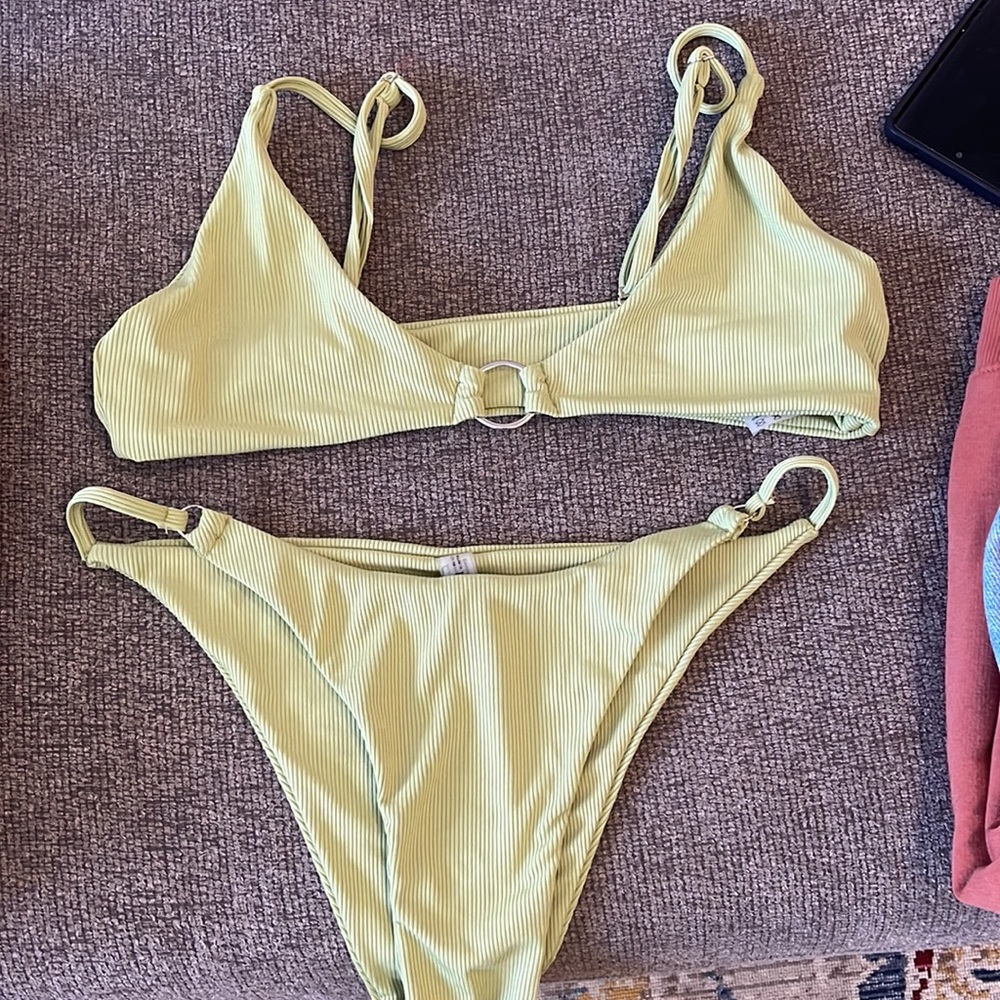 Zach loves green bikini with ring detail. Never worn